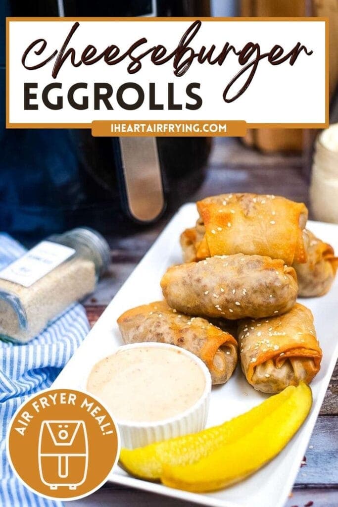 a stack of air fryer cheeseburger egg rolls on a plate next to sauce and pickles with text overlay
