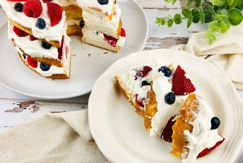 layered angel food cake on two white plates