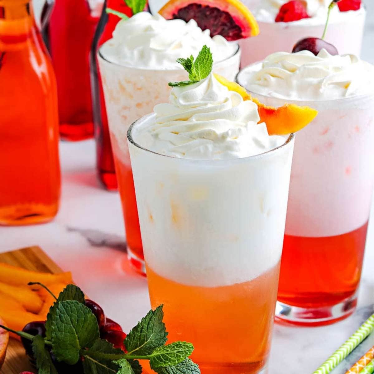 three italian cream sodas with garnishes