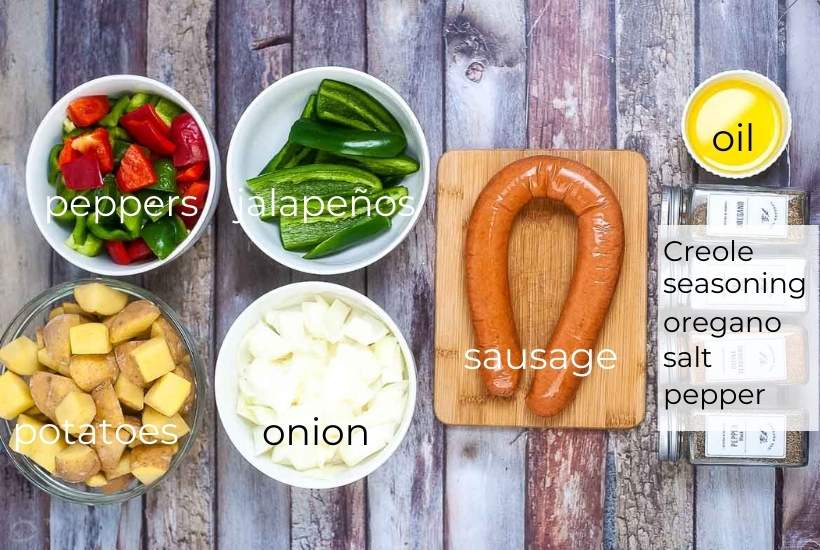 ingredients needed to make smoked sausage, potatoes, peppers and onions