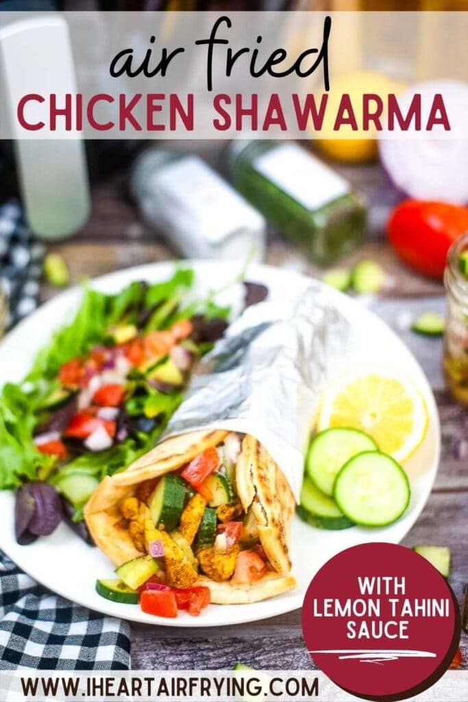 Air Fryer Chicken Shawarma wrapped in foil with a salad on a white plate with text overlay.
