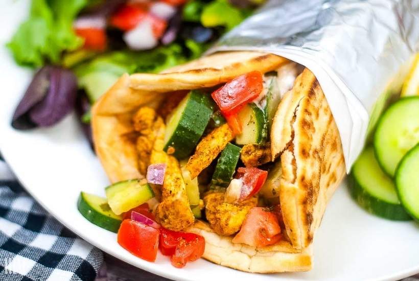 close up Air Fryer Chicken Shawarma wrap on a plate.