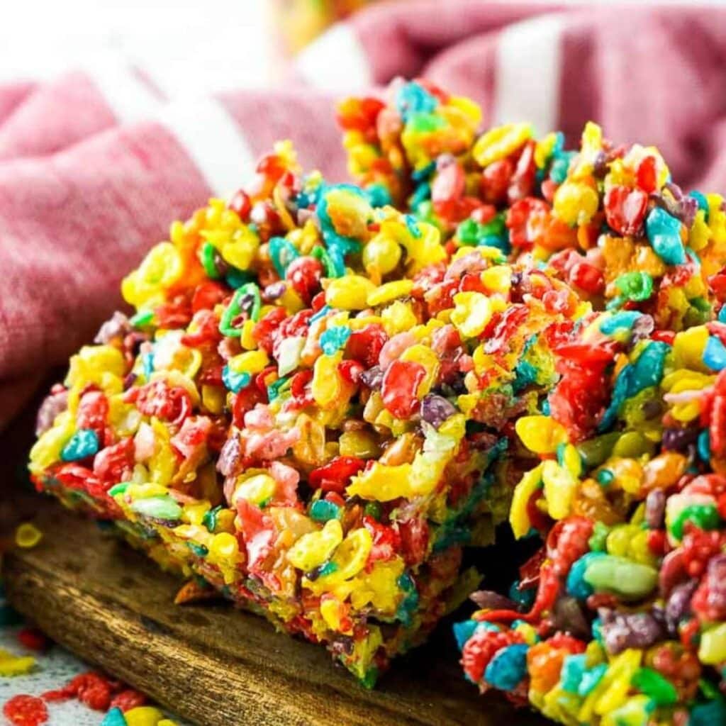 close up of fruity pebble rice krispie treats cut into squares