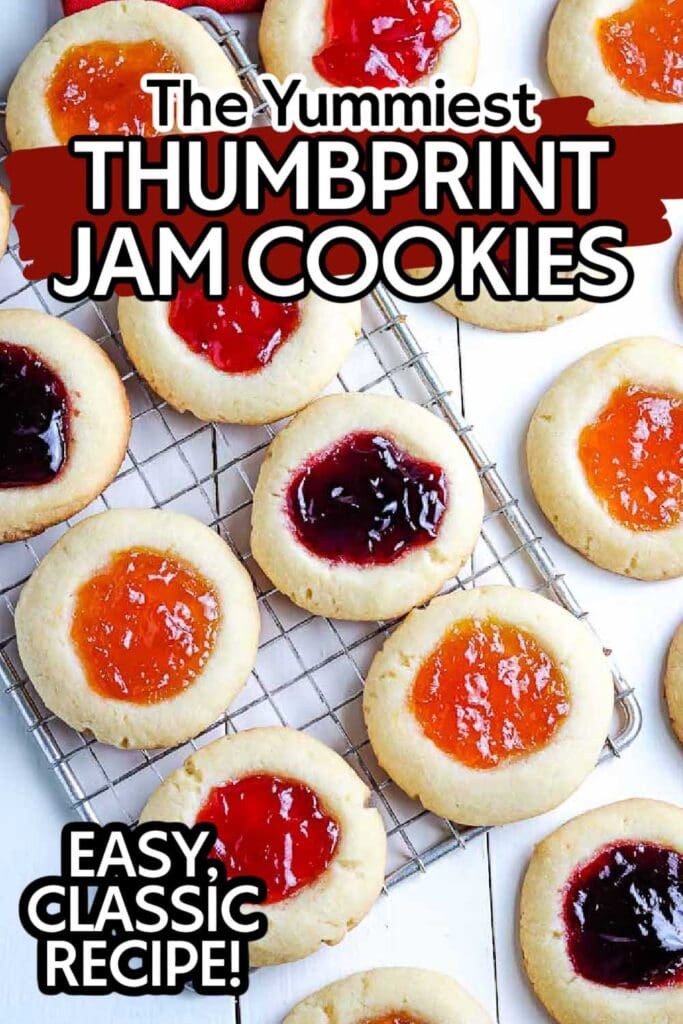 overhead view of cooked jam cookies on a cooling rack with text overlay.