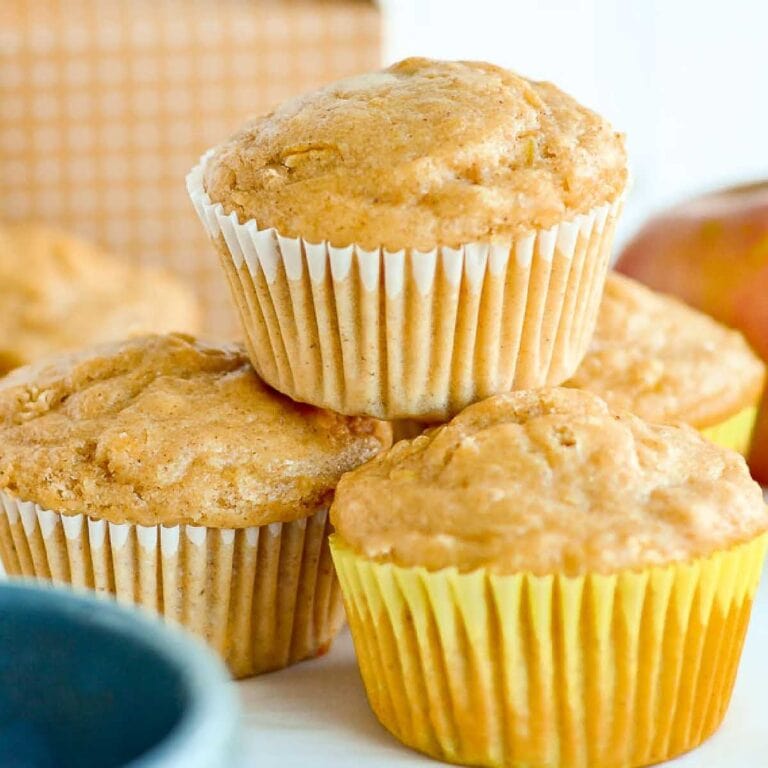 Close up of stacked apple oat muffins.