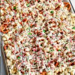 cookie sheet with christmas crack chex mix