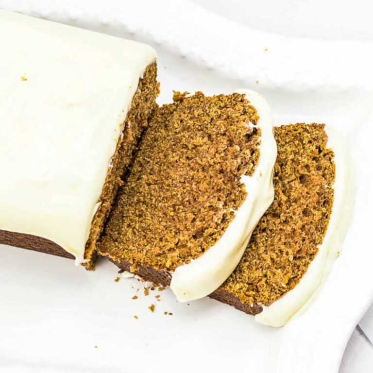 top view of starbucks gingerbread loaf two slices sliced on white platter