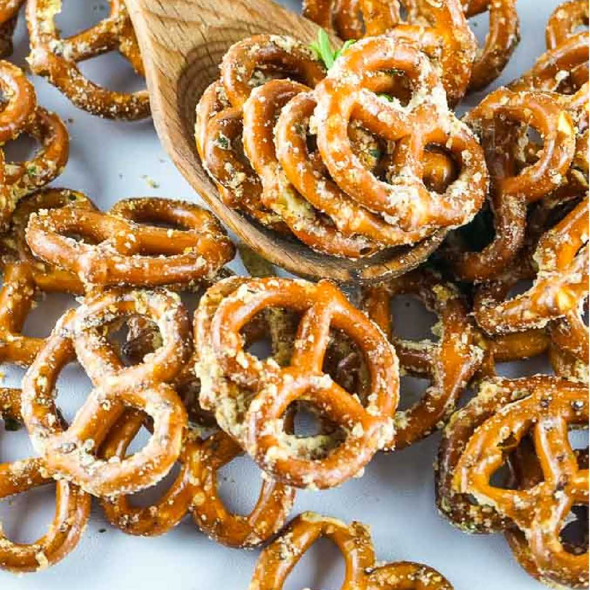 top close up of bake ranched pretzels with wooden spoonful