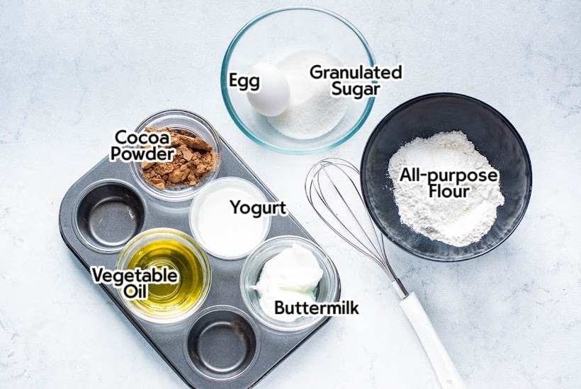 ingredients needed to make chocolate cheesecake muffins with text overlay.