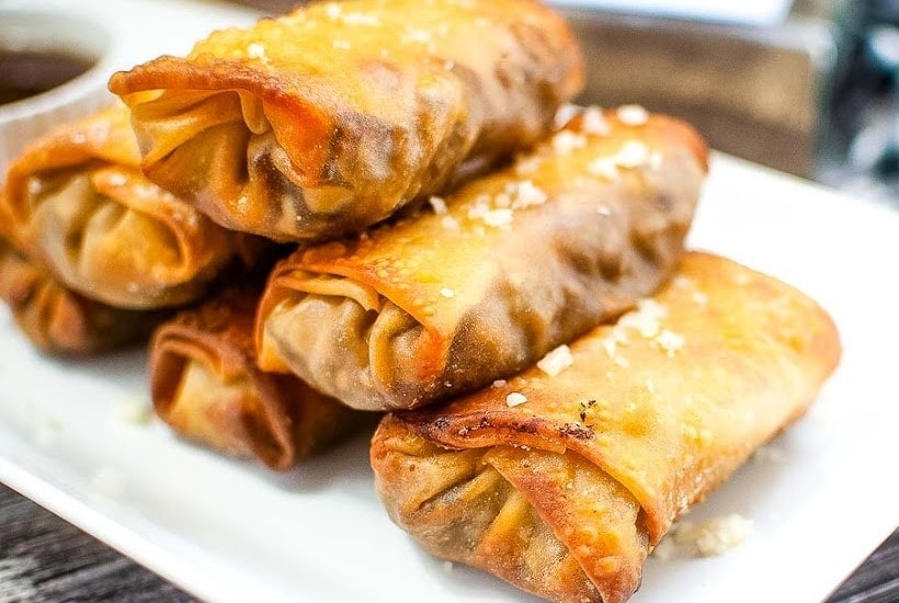 front close up view of cheesesteak egg rolls air fryer.