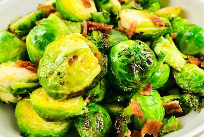 close up of cooked brussels sprouts with bacon and maple.