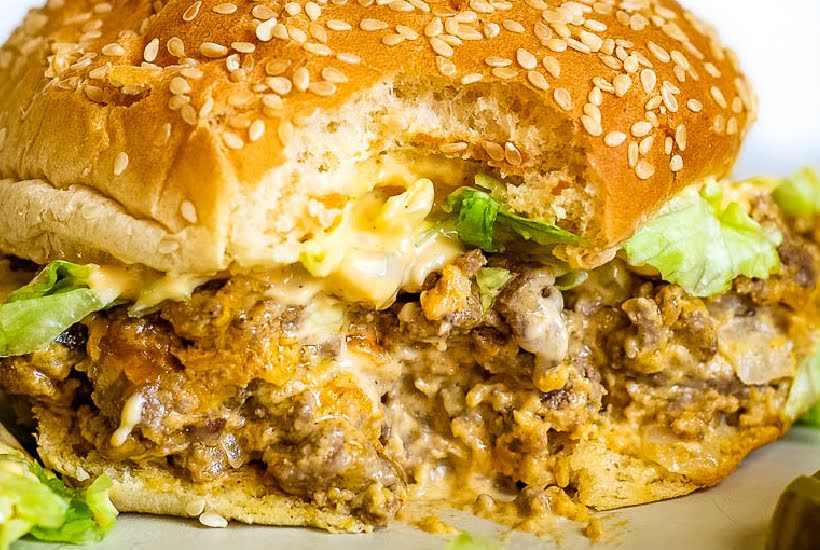 Close up of big mac sloppy joe sandwich with a bite taken from it.