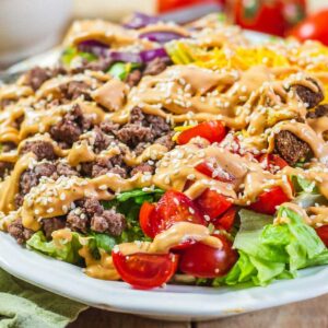 Front view of Big Mac in a Bowl with dressing and sesame seeds.