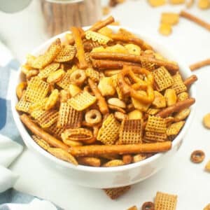 top view of air fryer chex mix in a white bowl.