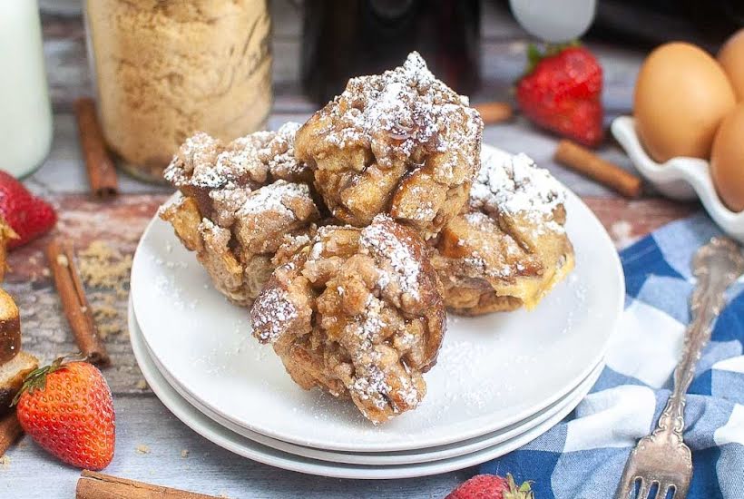 Four air fried French toast muffin cups on a plate.