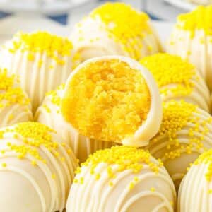 Front close up of Lemon Cake Balls a bite taken from one.
