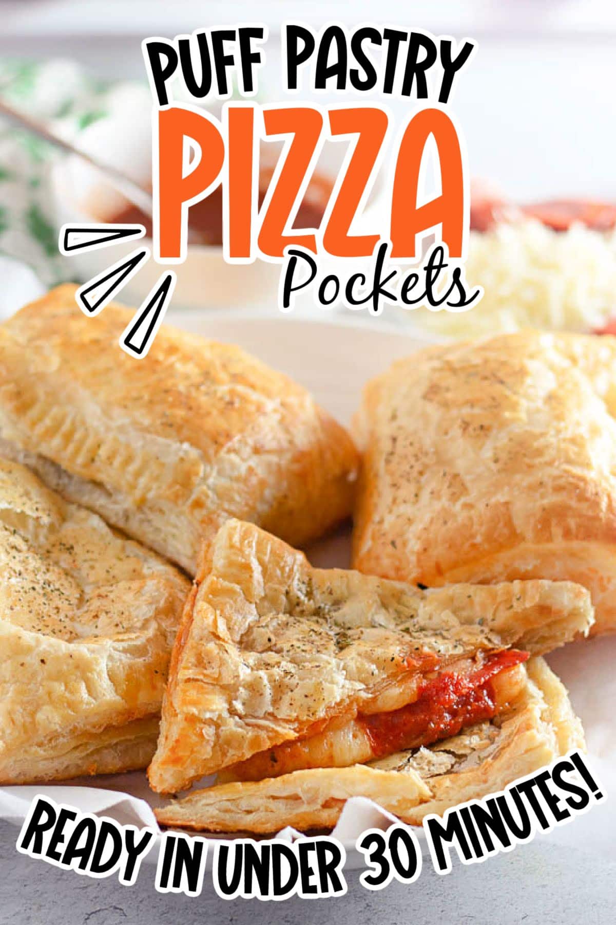 Closeup view of Pepperoni Puff Pastry Pizza Pockets on a white plate with text overlay.
