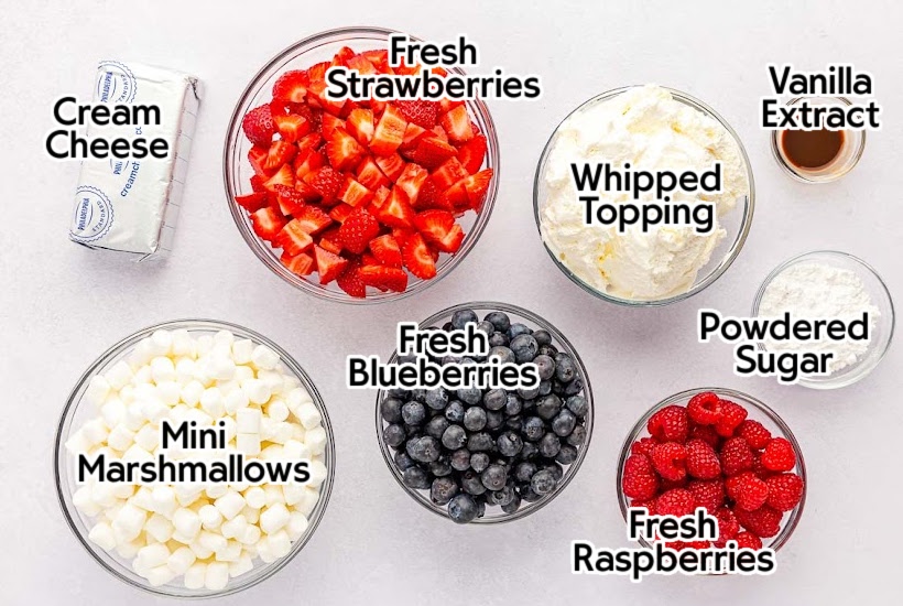 Ingredients needed to make red white and blue cheesecake salad with text overlay.