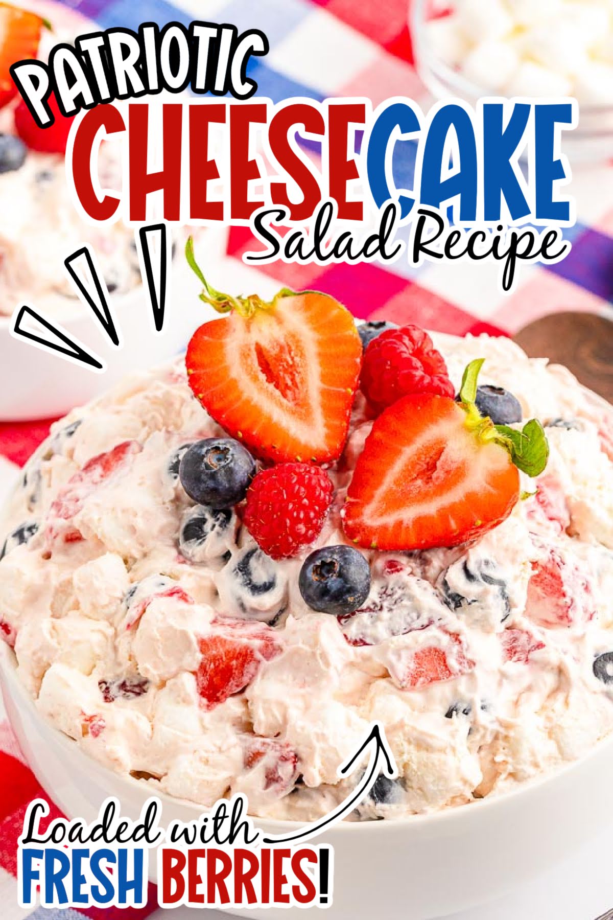 Closeup view of Red White and Blue Cheesecake Salad in a white bowl with text overlay.