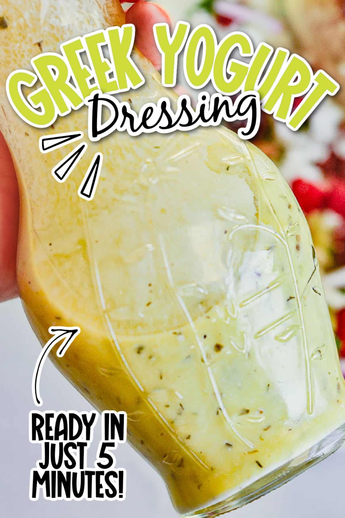 Close up view of Greek Yogurt Dressing in a glass container with text overlay.
