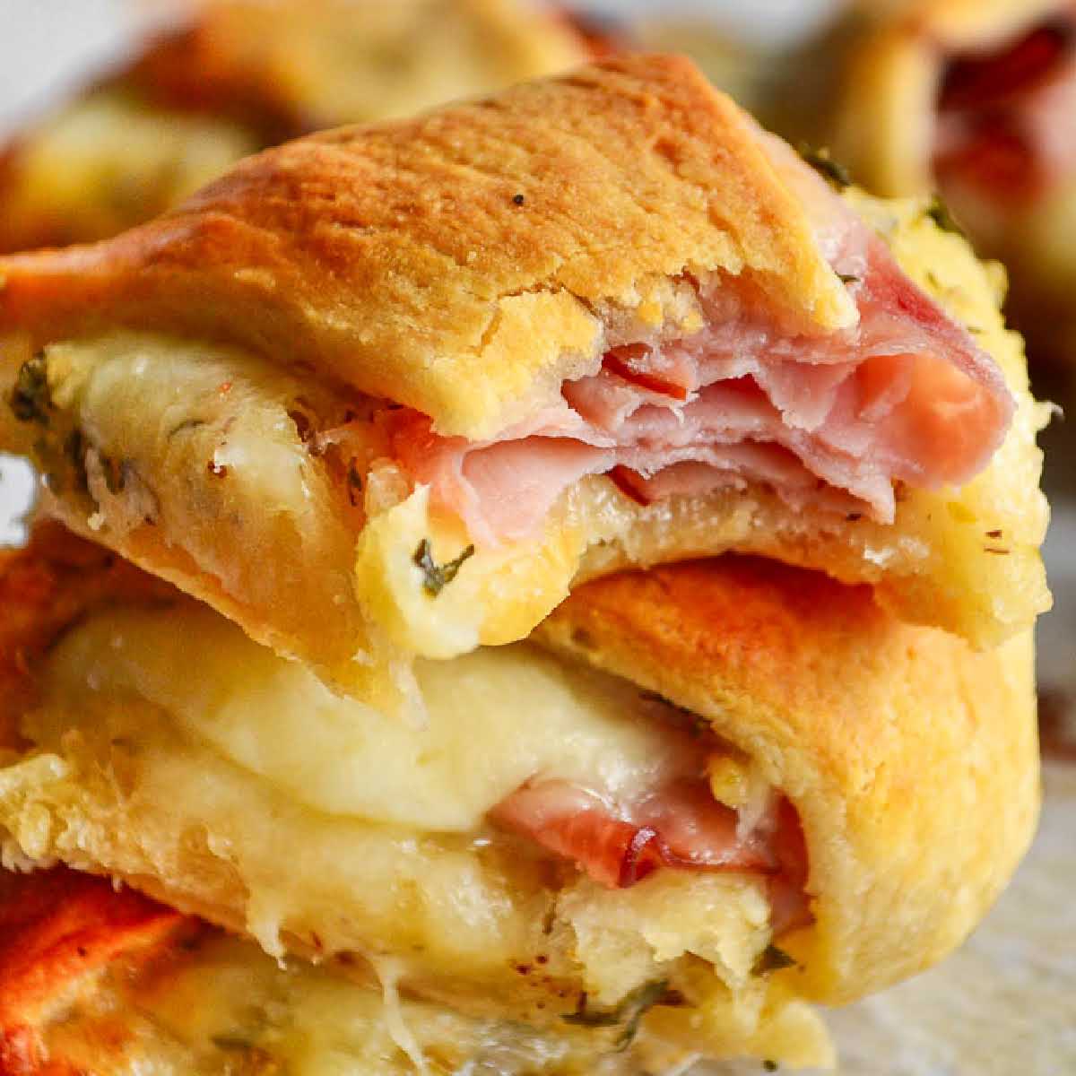 Close up of a stack of Ham and Cheese Crescent Ring slices.