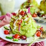A plate of Mediterranean Wedge Salad with a fork.