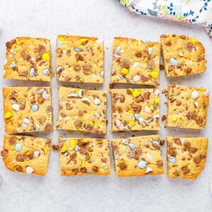 Overhead view of Cadbury Mini Egg Cookie Bars cut into squares.