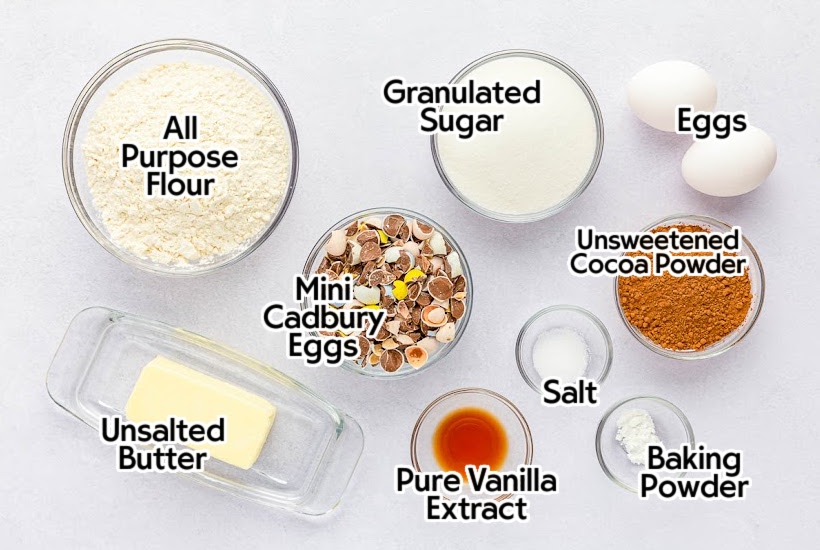 Ingredients needed to make homemade Cadbury Mini Egg Brownies with text overlay labels.