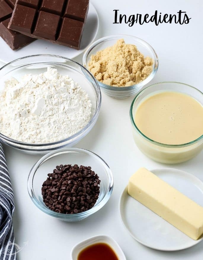 Ingredients to make chocolate cookie dough bites truffles on a white backlay.