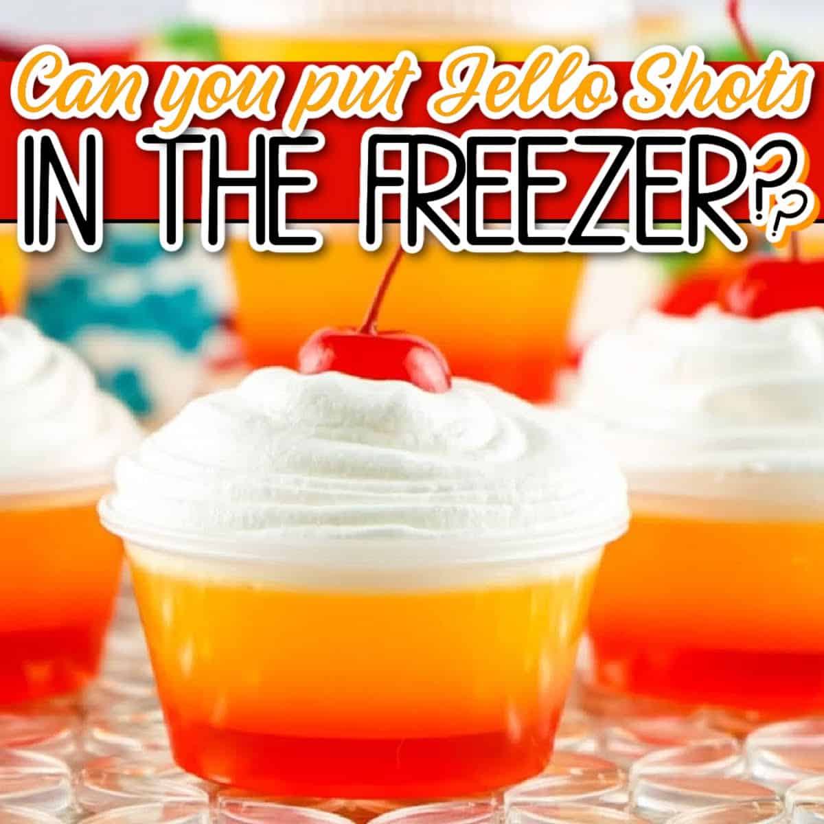 Closeup view of layered jello shots garnished with whipped cream and a cherry with "Can you put jello shots in the freezer" text overlay.
