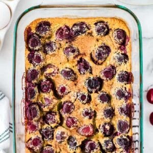 Pan of baked cherry clafouti custard dessert.