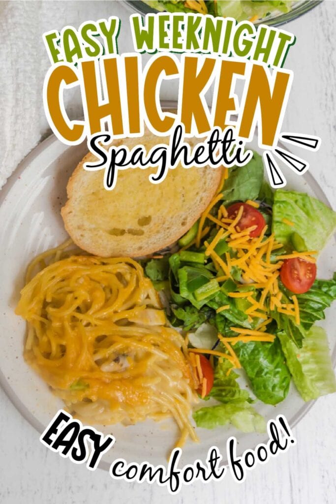 Easy chicken spaghetti, green salad with cheese and a slice of garlic bread on a white plate with text overlay.