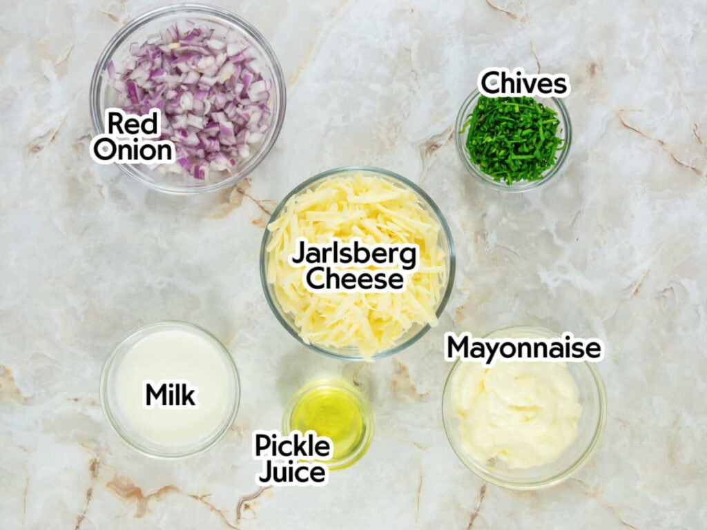 Bowls of ingredients to make Jarlsberg cheese spread with text labels.