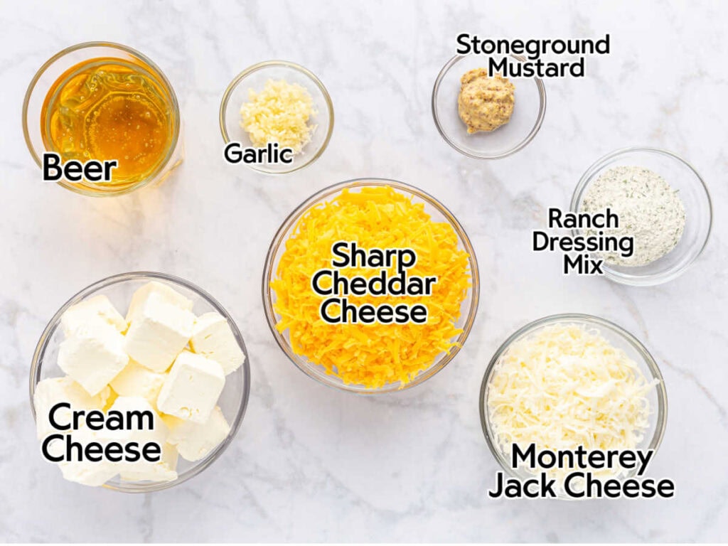 Bowls filled with ingredients to make ranch beer cheese dip with text labels.