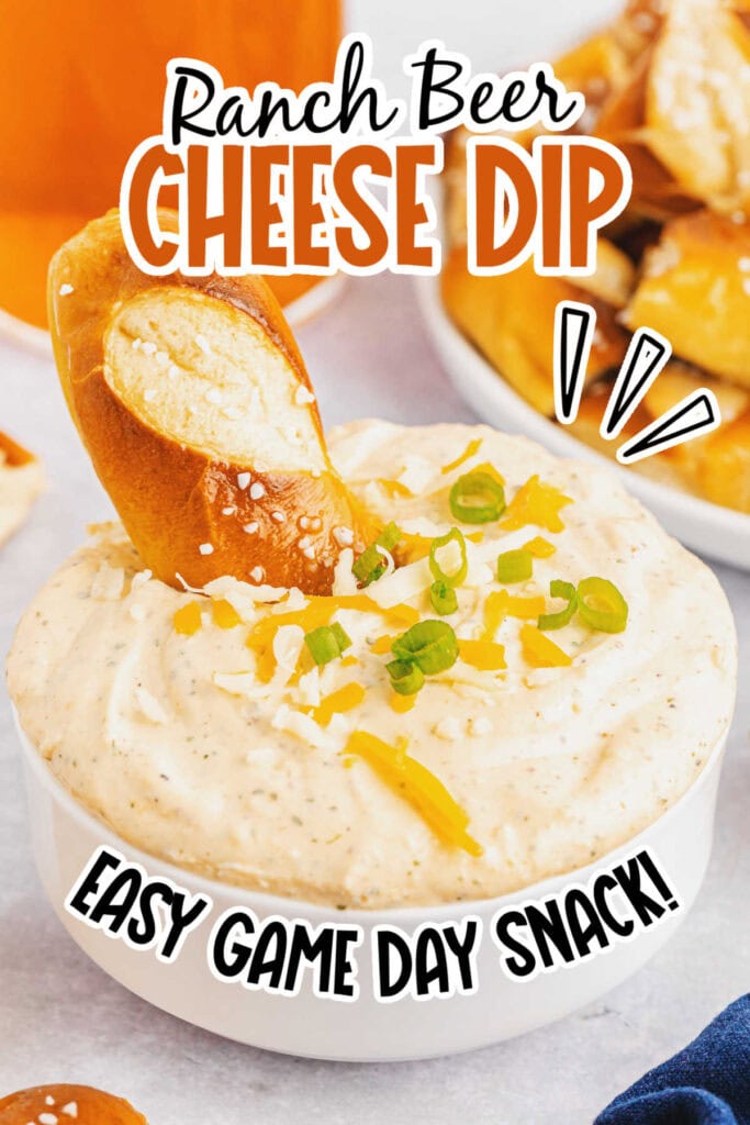White bowl filled with cheese dip with soft pretzels and text overlay.