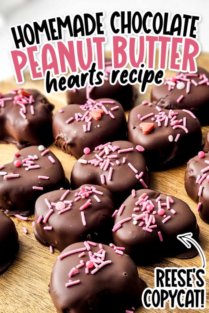Closeup view of chocolate covered peanut butter hearts topped with sprinkles with text overlay.