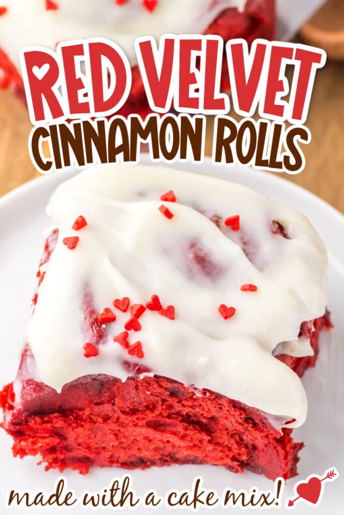 Closeup view of a cinnamon roll made with red velvet cake mix and topped with cream cheese frosting and red sprinkles with text overlay.