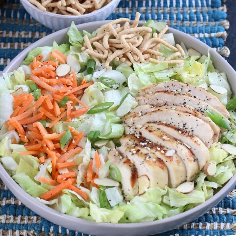 Closeup view of copycat Applebee's Asian Chicken Salad with crunchy noodles.