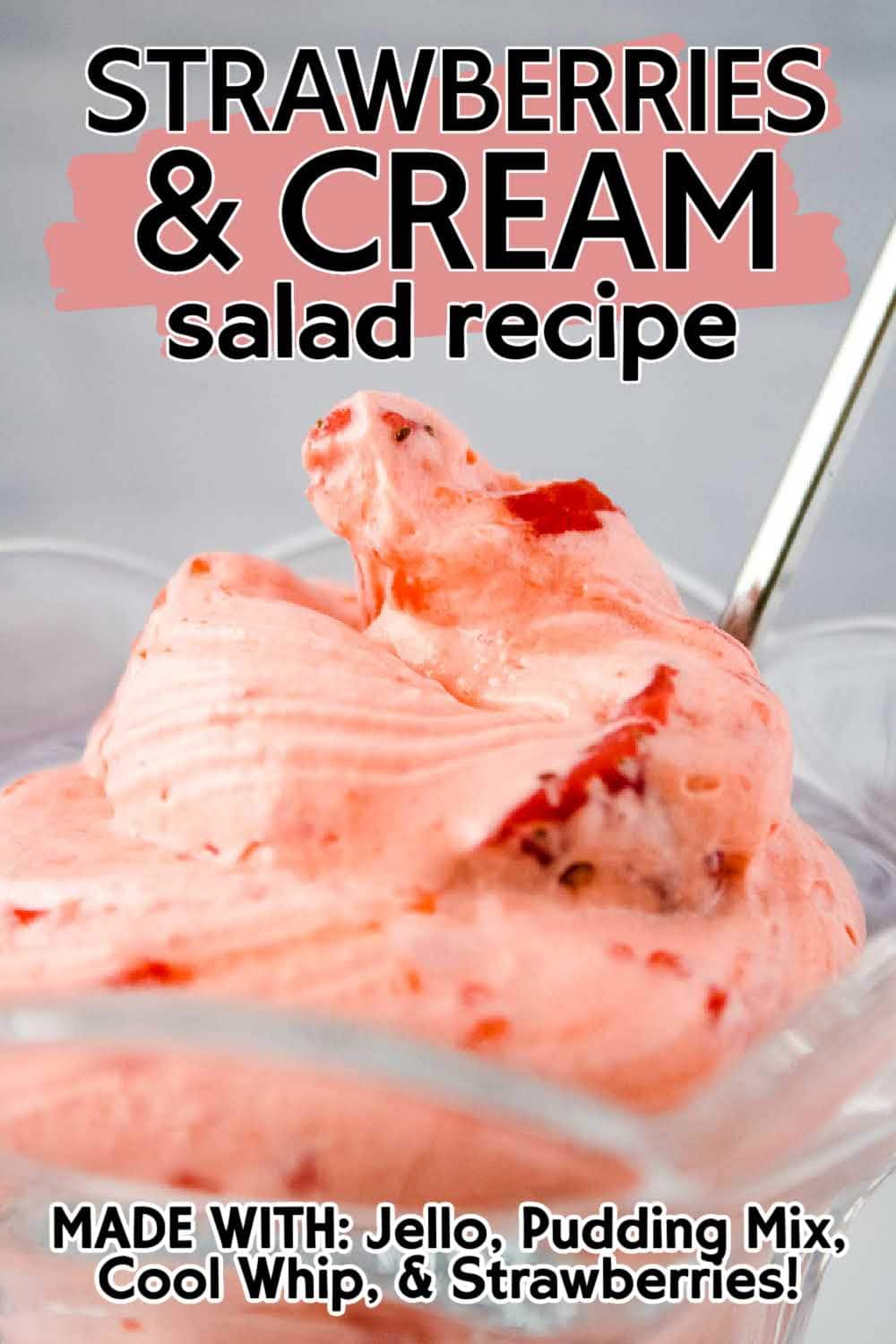 Close up view of a decorative glass filled with strawberry Cool Whip salad with text overlay.