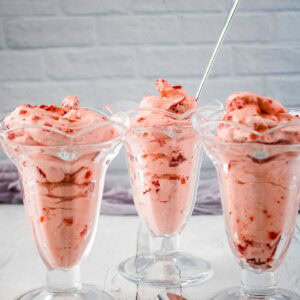 Trio of glasses filled with strawberry cream salad.