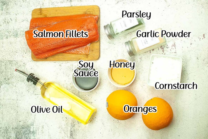 Ingredients needed to make air fryer salmon with honey orange glaze recipe with text overlay.