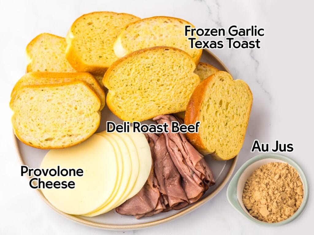 Ingredients to make garlic bread French dips recipe on a plate and a bowl with the au jus mix with text labels.