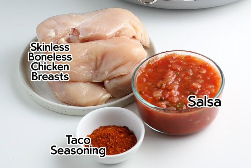 Ingredients to make salsa chicken in the crockpot with text labels.