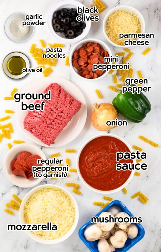 Ingredients needed to make baked pizza pasta casserole recipe with text labels.