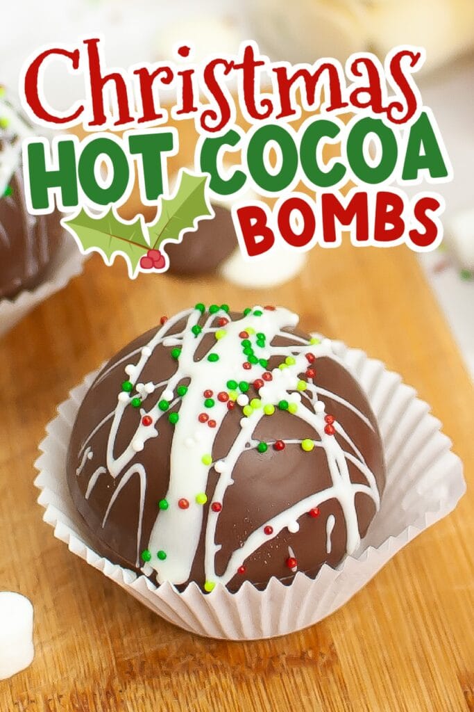 A hot chocolate bomb decorated with Christmas sprinkles with text overlay.