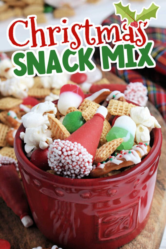 Close view of Santa hat Christmas party mix in a red bowl with text overlay.