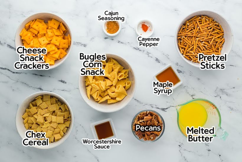 Ingredients to make the reindeer snack mix with bugles recipe with text labels.