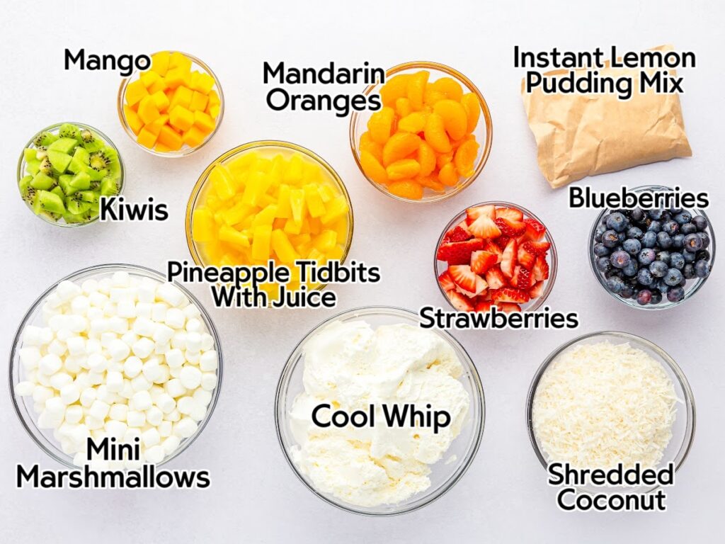 Ingredients needed for creamy tropical fruit salad with text labels.