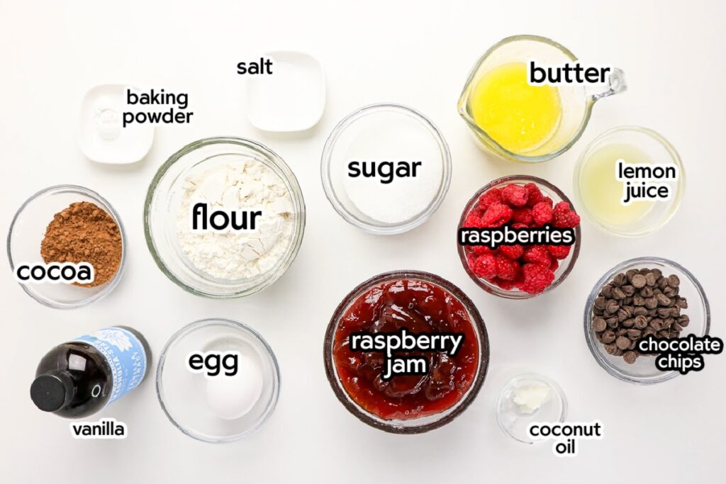 Ingredients needed to make homemade raspberry chocolate bars with text labels.