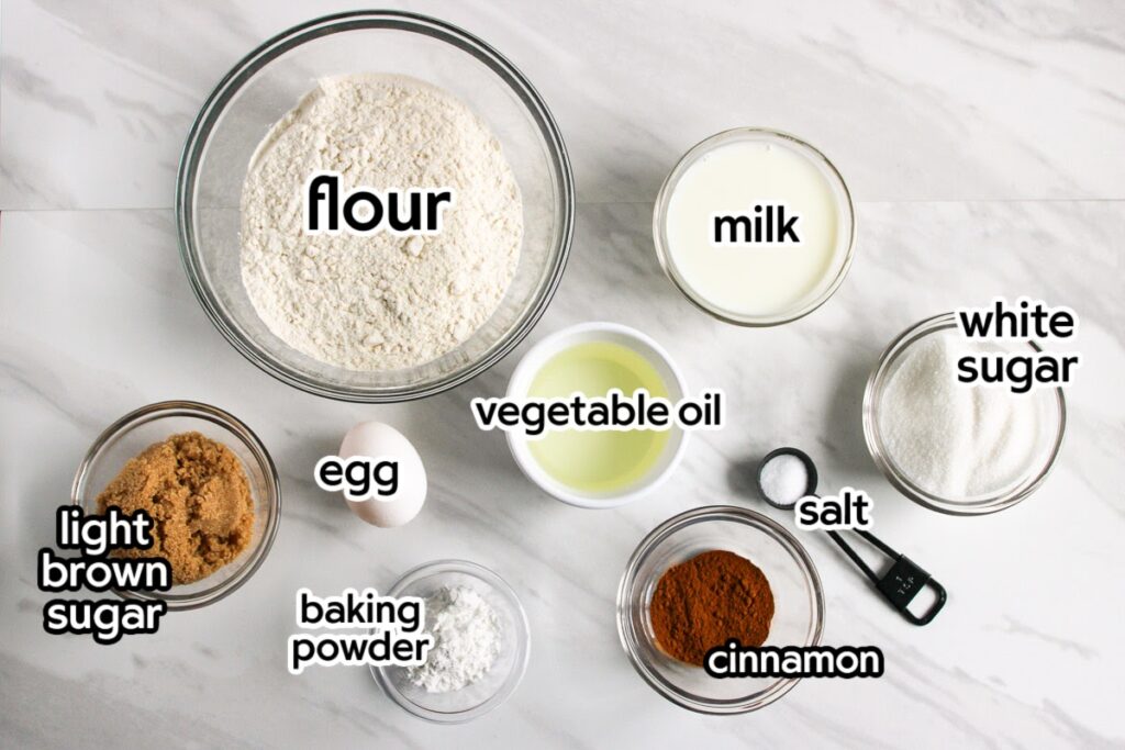 Ingredients needed to make homemade cinnamon loaf with text labels.